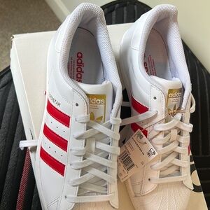 Adidas Superstar NWT. Red stripe. Perfectly new condition.